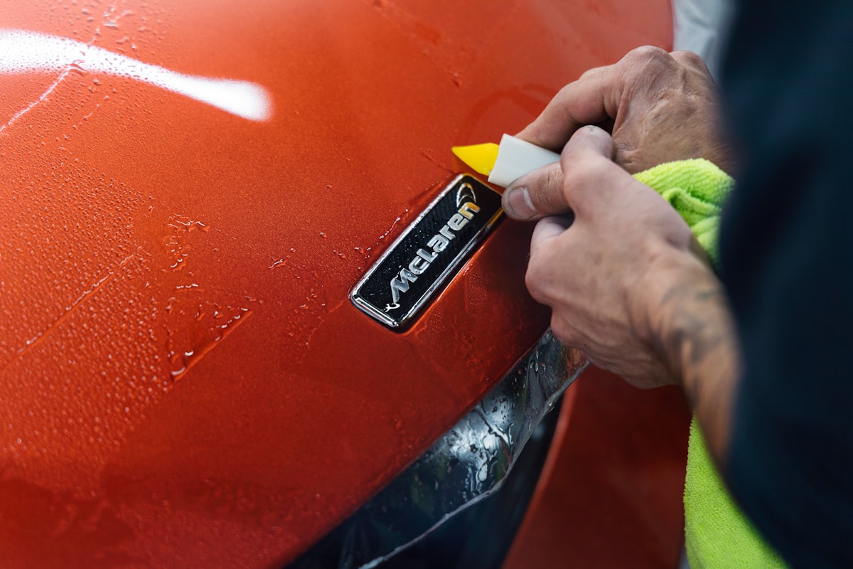 Protection film being trimmed around a badge